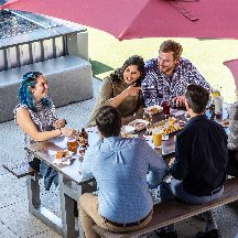 Young people at a food hall in Greenville SC